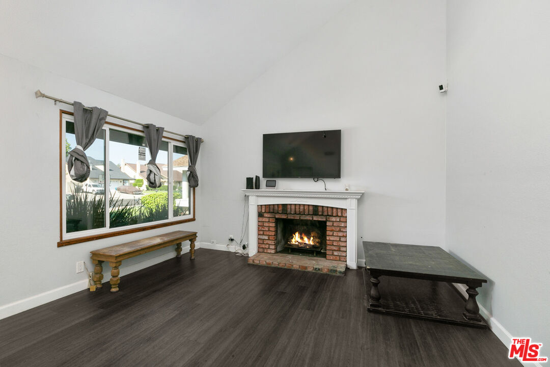 6703 Poinsettia Court Chino, CA 91710 - Photo 10 of 36 a living room with furniture and a fireplace