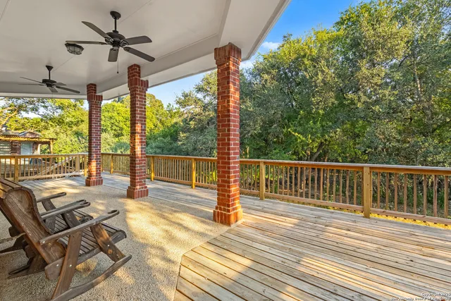 a view of a yard with large trees