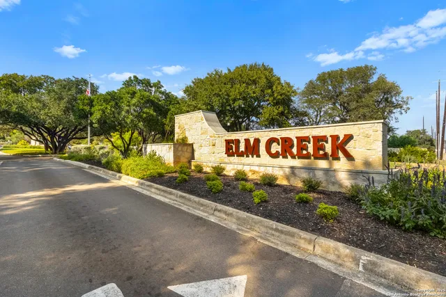 a view of a yard with yellow lighting