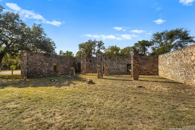 a view of swimming pool with trees in the background