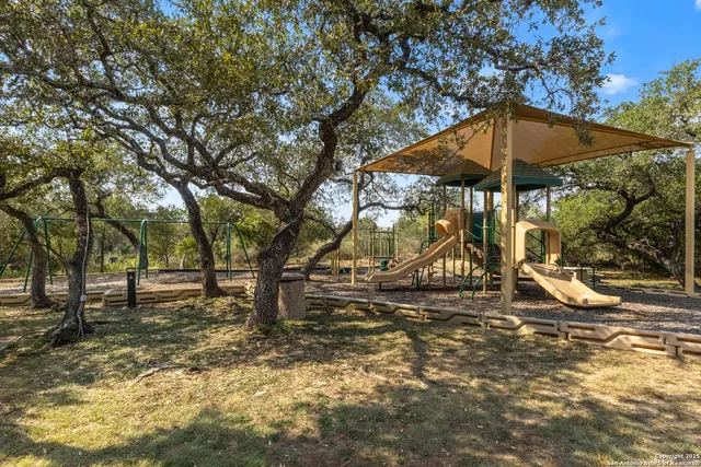 a view of a swimming pool with an outdoor space and seating area