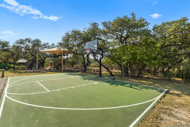 an aerial view of a houses with a yard