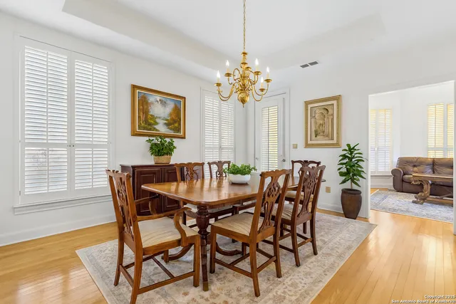 a living room with furniture wooden floor and a window