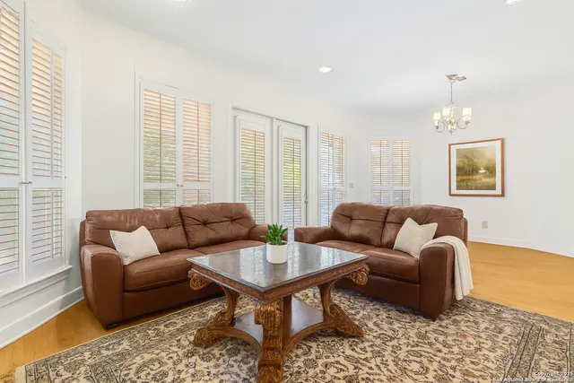 a view of a kitchen with wooden floor and electronic appliances