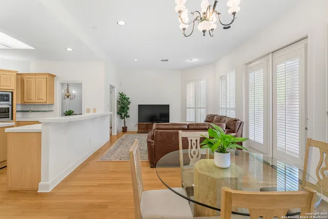 a bedroom with a large bed and a ceiling fan