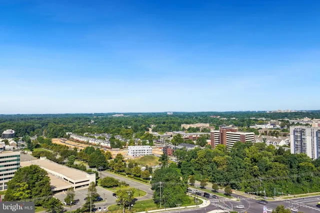 a outdoor space with a large pool table and chairs