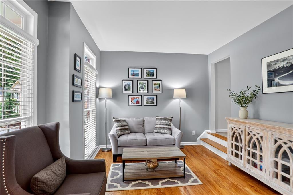 4760 Fontwell Court Suwanee, GA 30024 - Photo 11 of 43 a living room with furniture and a potted plant