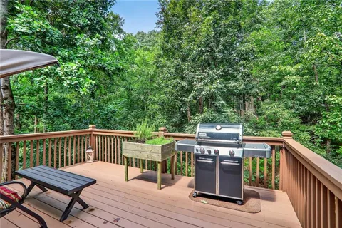 a view of a deck with wooden floor and furniture