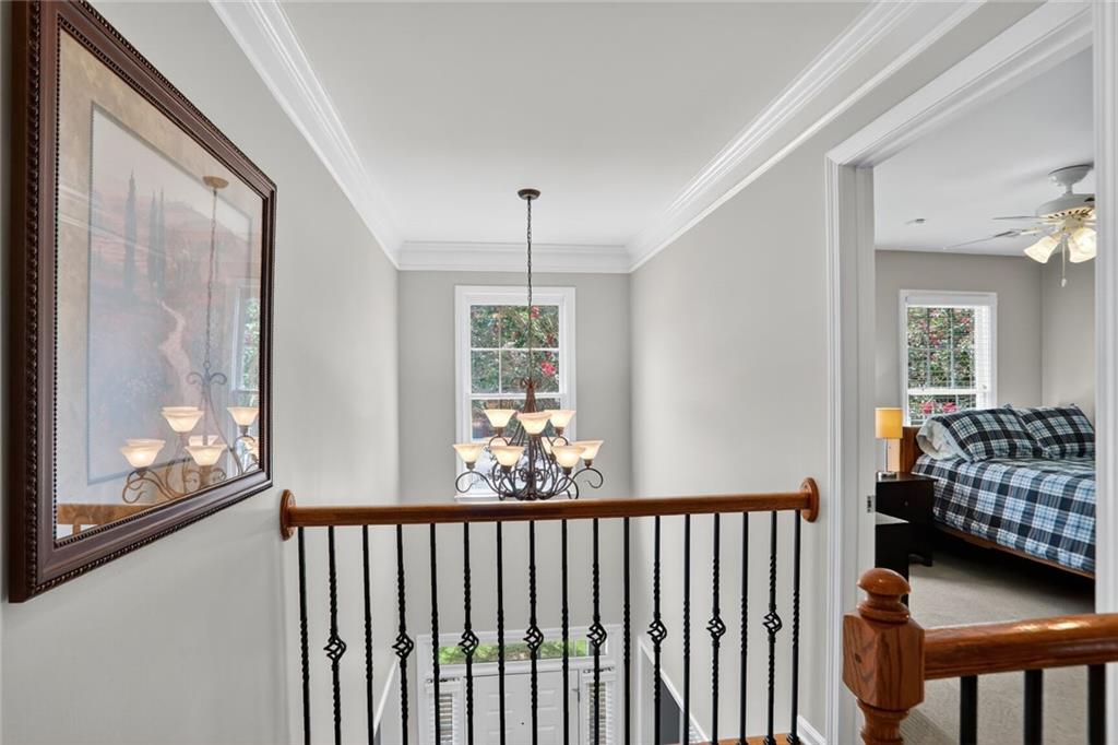 4760 Fontwell Court Suwanee, GA 30024 - Photo 16 of 43 a view of a room with wooden floor and windows