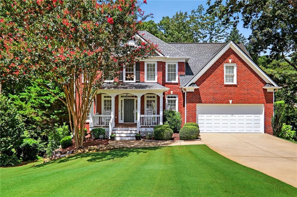 4760 Fontwell Court Suwanee, GA 30024 - Photo 2 of 43 a front view of a house with a yard