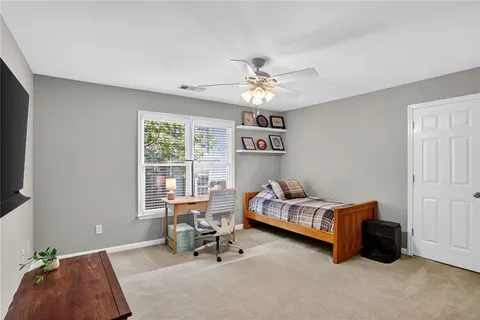 a bedroom with furniture and a window