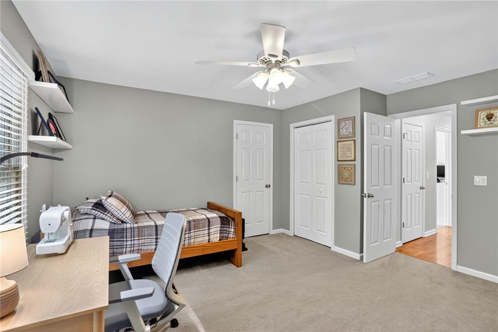 4760 Fontwell Court Suwanee, GA 30024 - Photo 25 of 43 a view of a livingroom with furniture and chandelier fan