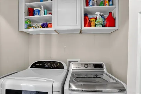 a kitchen with a stove and cabinets