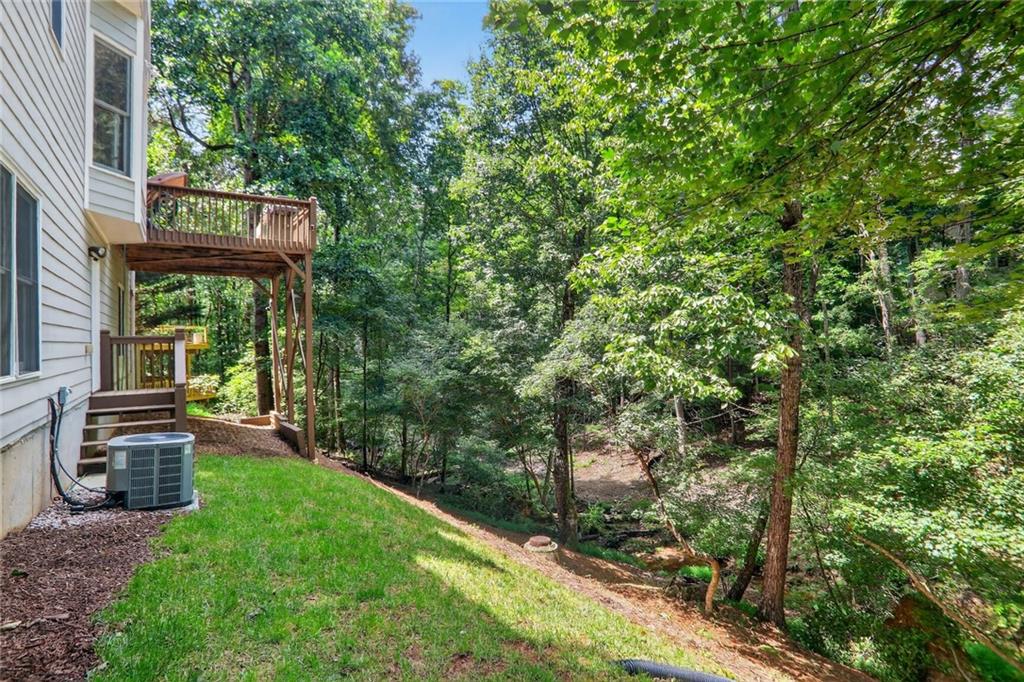 4760 Fontwell Court Suwanee, GA 30024 - Photo 36 of 43 a view of a wooden bench sitting in front of a building