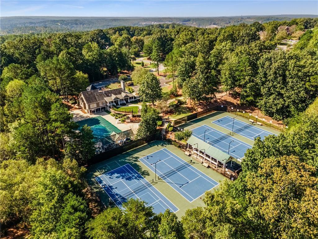 4760 Fontwell Court Suwanee, GA 30024 - Photo 37 of 43 an aerial view of residential houses with outdoor space