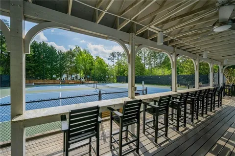 a view of a porch with wooden floor