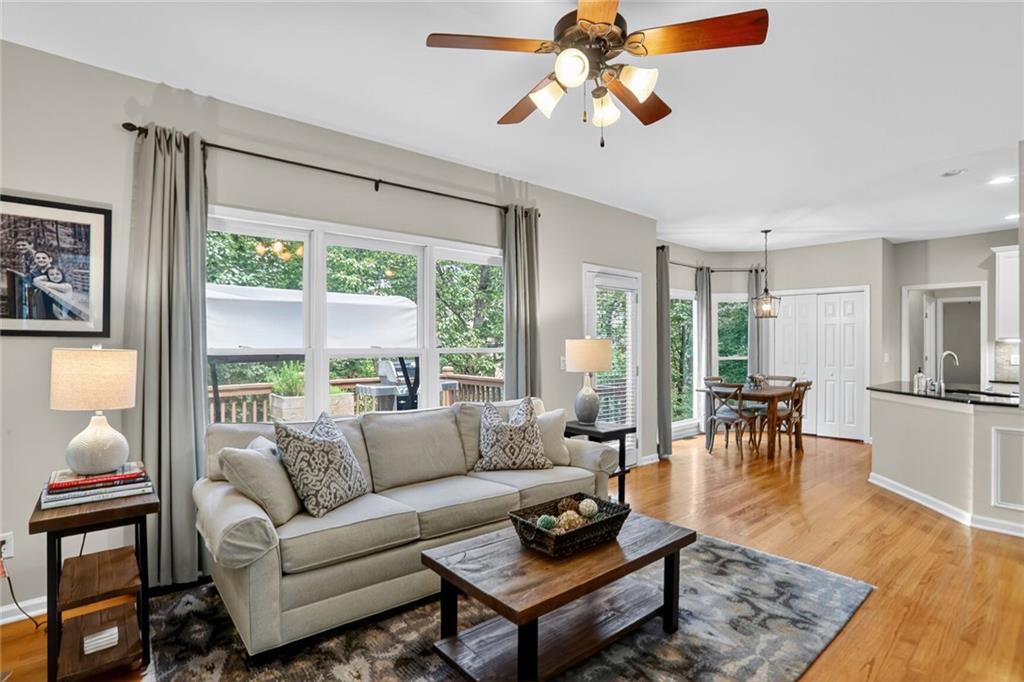 4760 Fontwell Court Suwanee, GA 30024 - Photo 7 of 43 a living room with furniture large window and a table