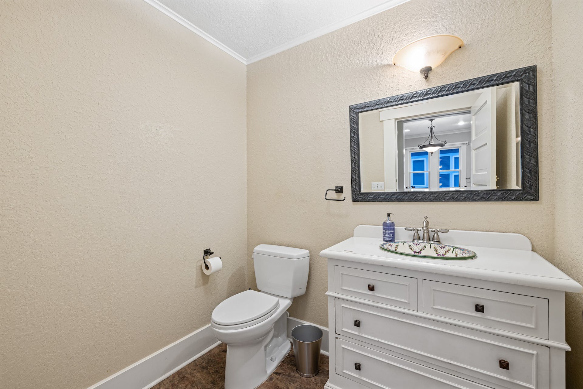 1211 Lexington Street Taylor, TX 76574 - Photo 23 of 40 a bathroom with a toilet sink and mirror