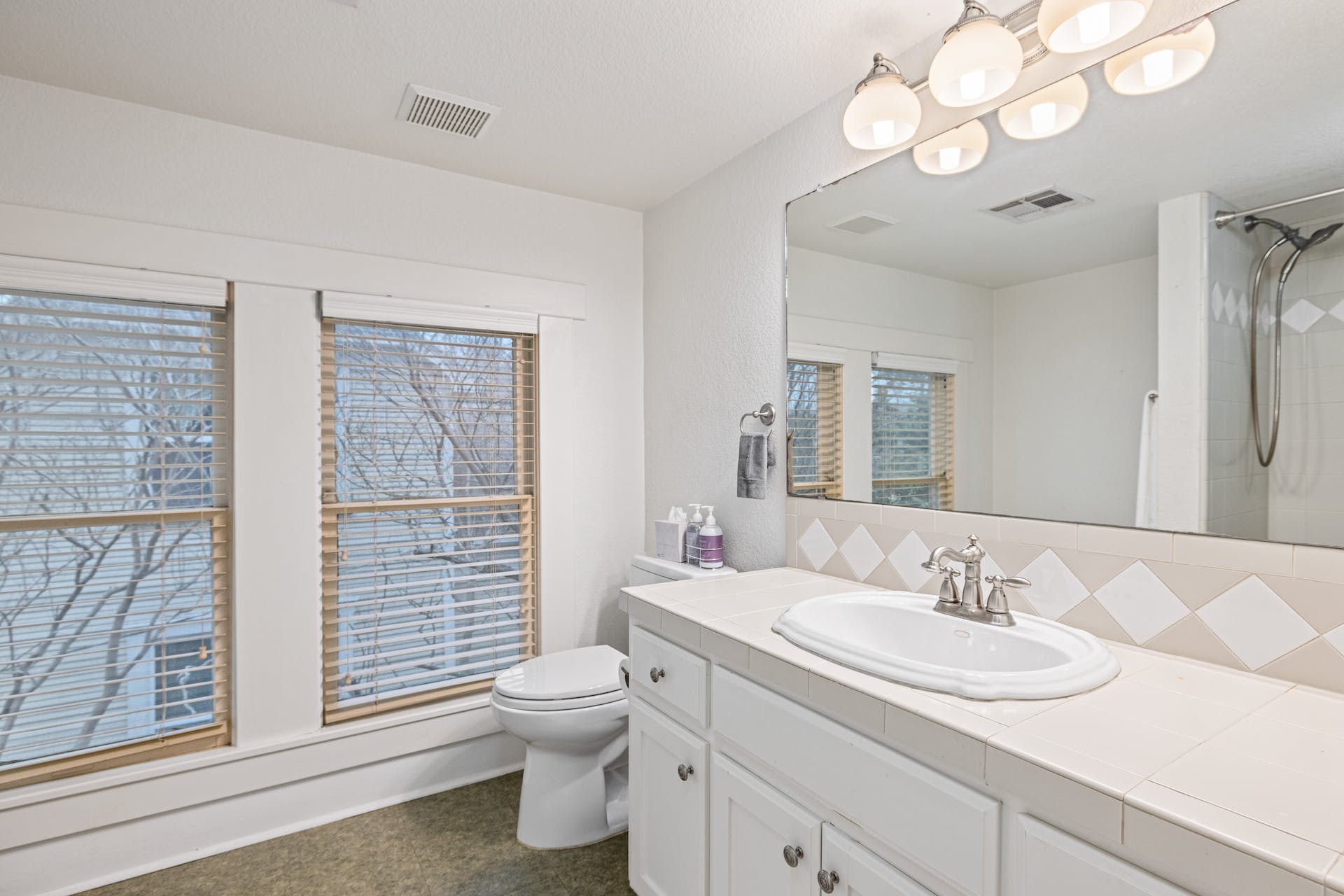 1211 Lexington Street Taylor, TX 76574 - Photo 30 of 40 a bathroom with a sink vanity granite and toilet