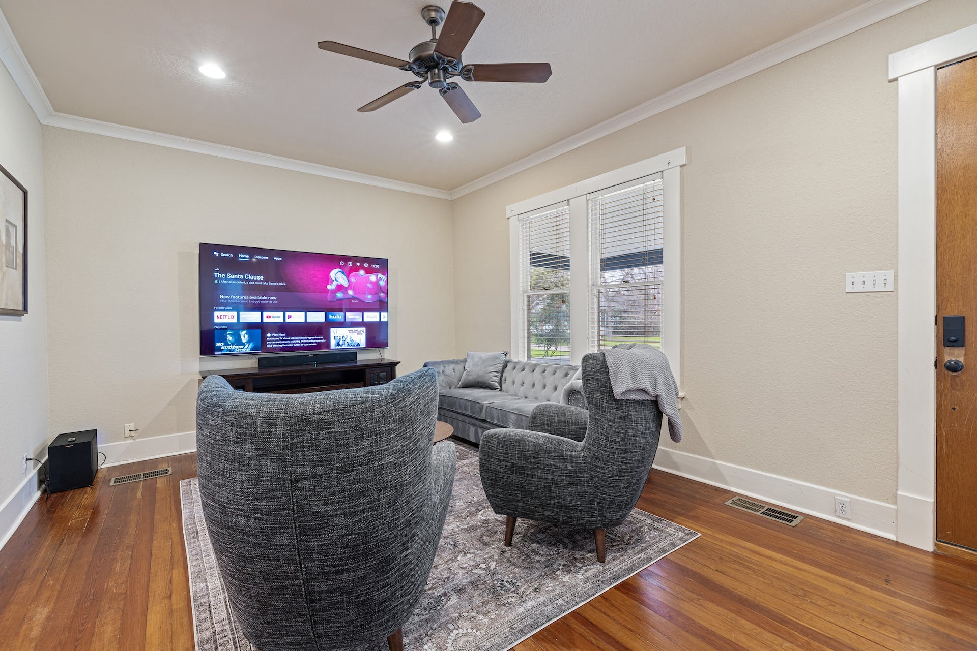 1211 Lexington Street Taylor, TX 76574 - Photo 4 of 40 a living room with furniture and a flat screen tv