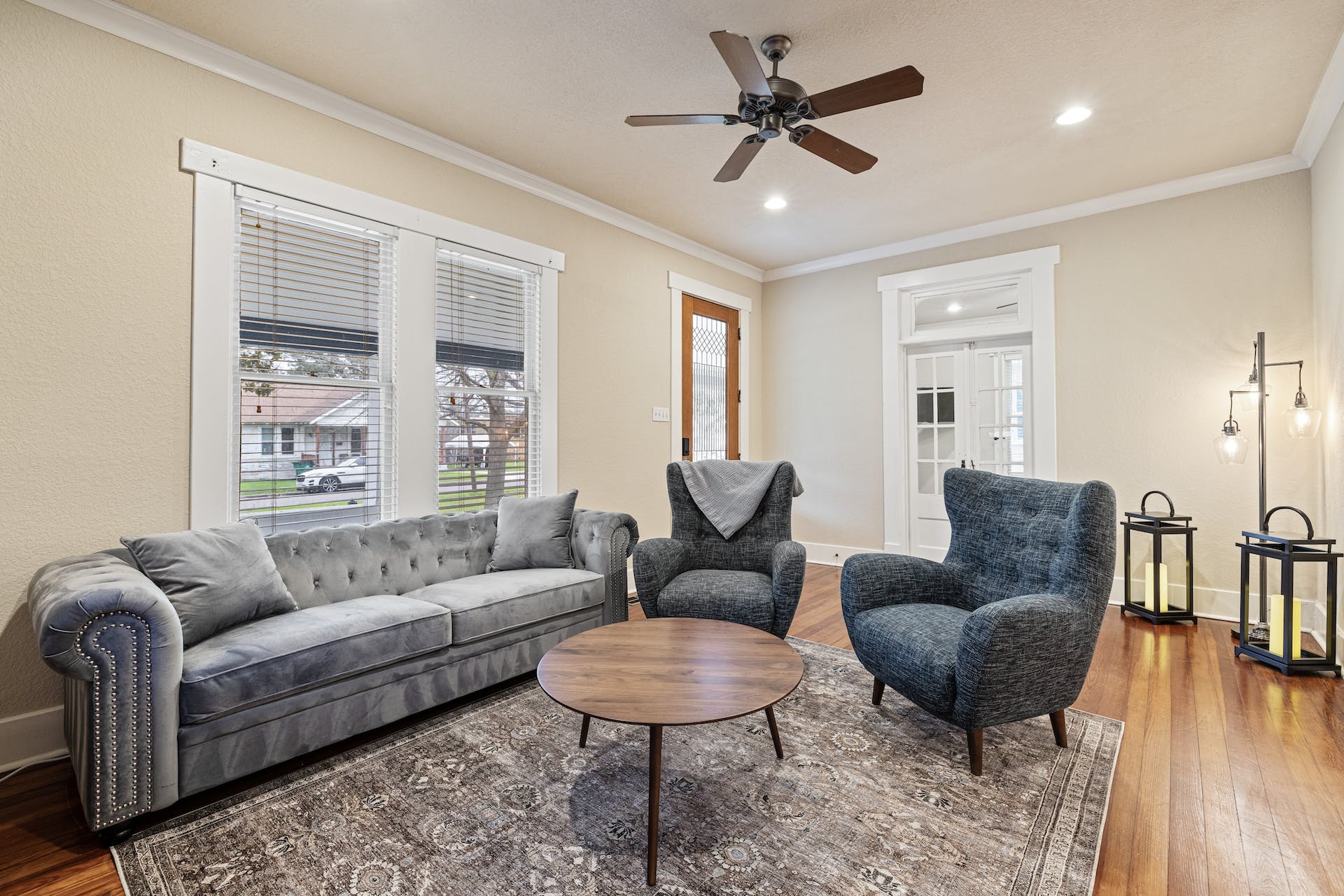 1211 Lexington Street Taylor, TX 76574 - Photo 5 of 40 a living room with furniture a ceiling fan a rug and a large window