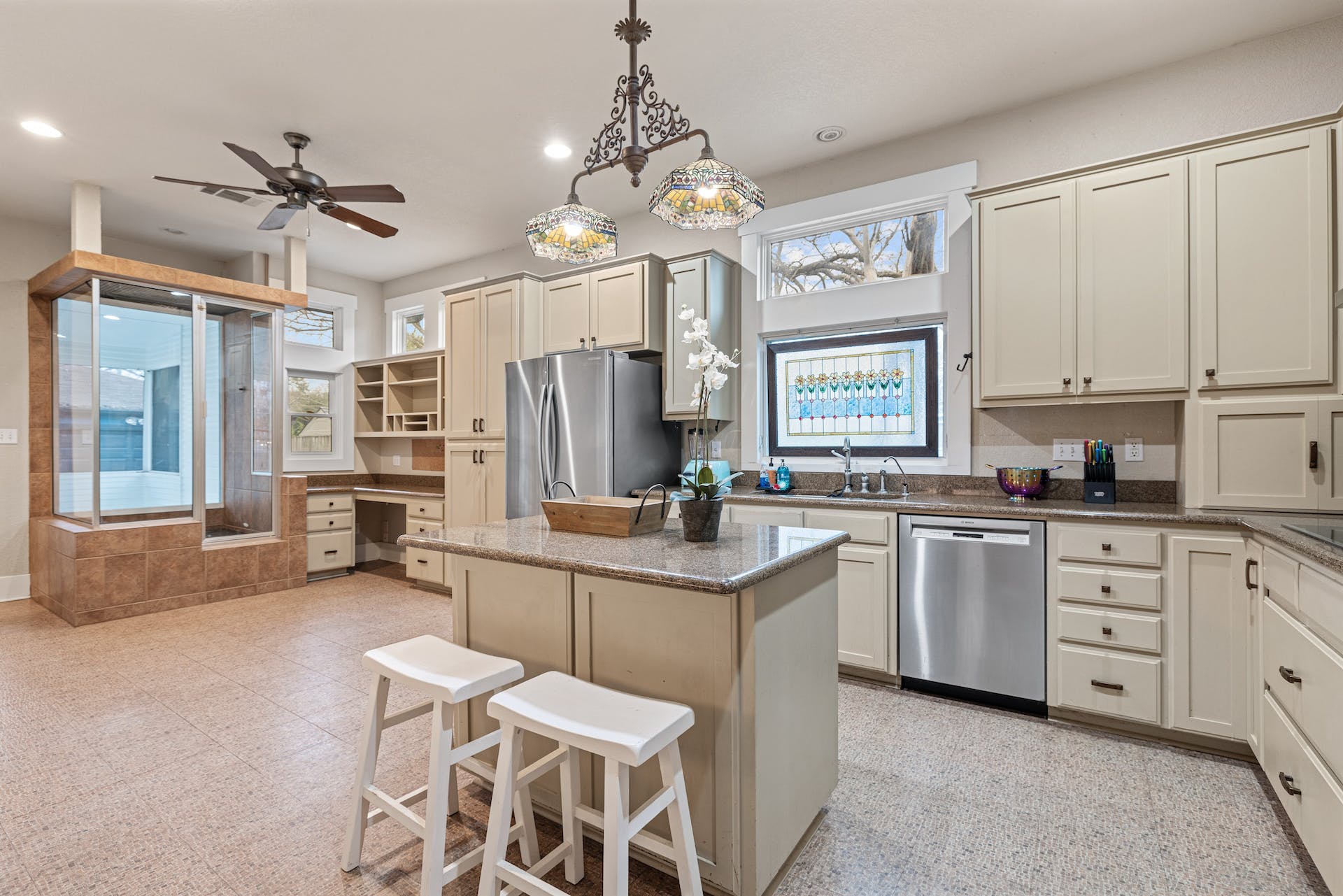1211 Lexington Street Taylor, TX 76574 - Photo 8 of 40 a kitchen with cabinets a center island and appliances