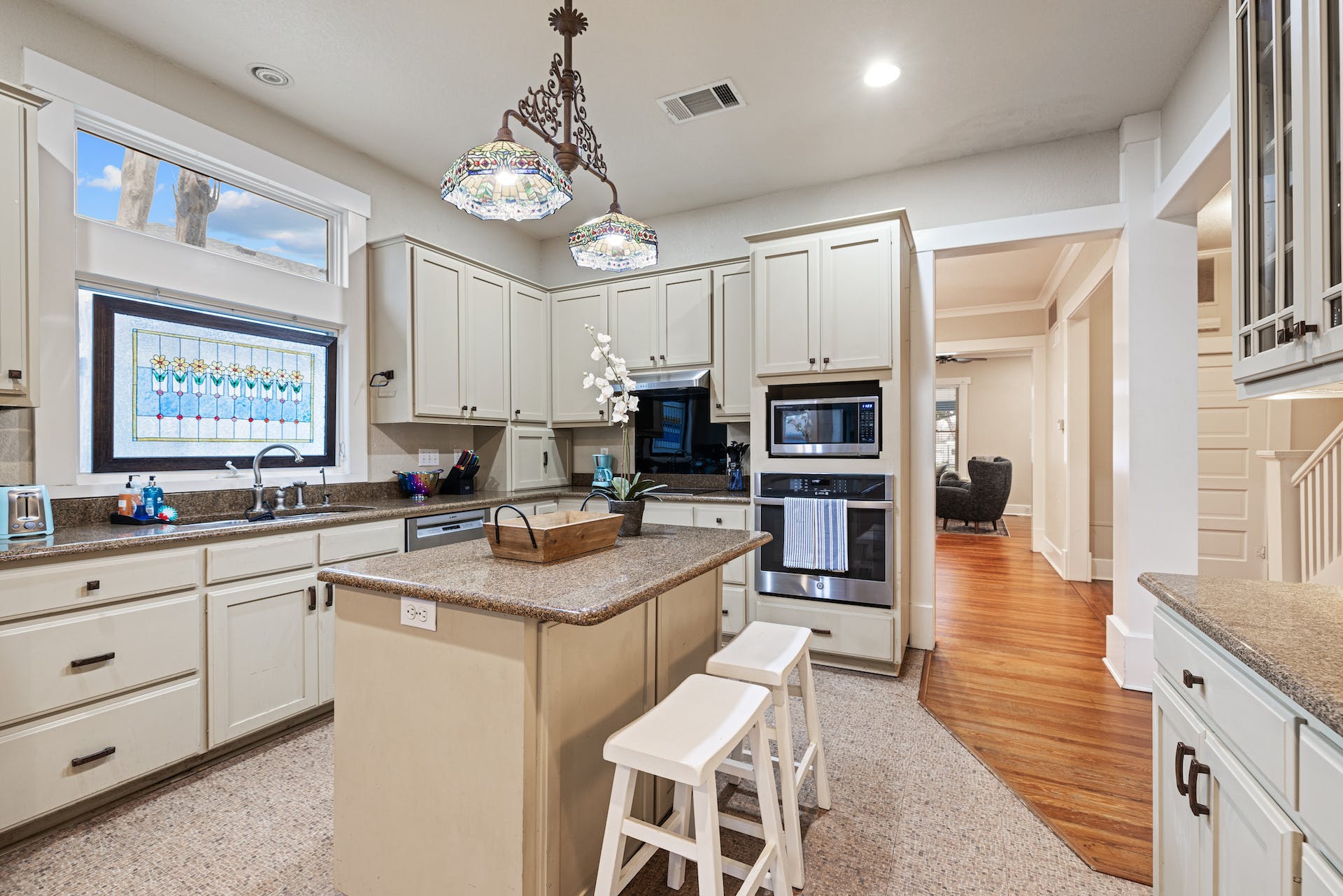 1211 Lexington Street Taylor, TX 76574 - Photo 9 of 40 a kitchen with stainless steel appliances granite countertop a sink a stove and a refrigerator