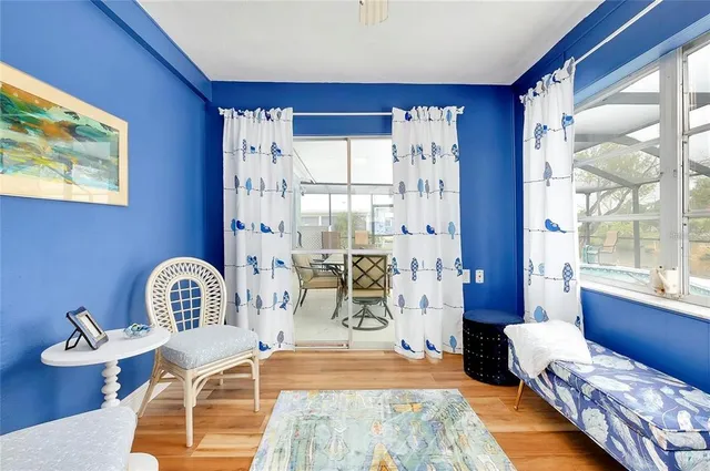 a bedroom with furniture and a window