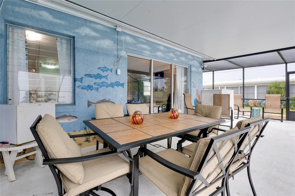 6560 Marius Road North Port, FL 34287 - Photo 22 of 35 a view of a dining room with furniture and wooden floor