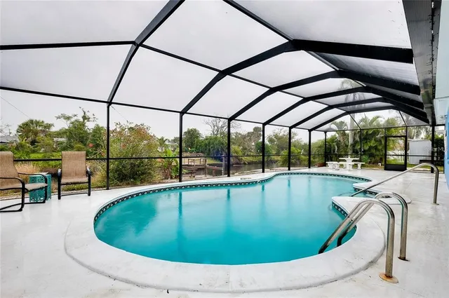 a view of a swimming pool with a porch