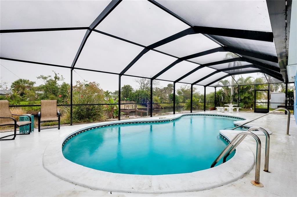 6560 Marius Road North Port, FL 34287 - Photo 30 of 35 a view of a swimming pool with a porch
