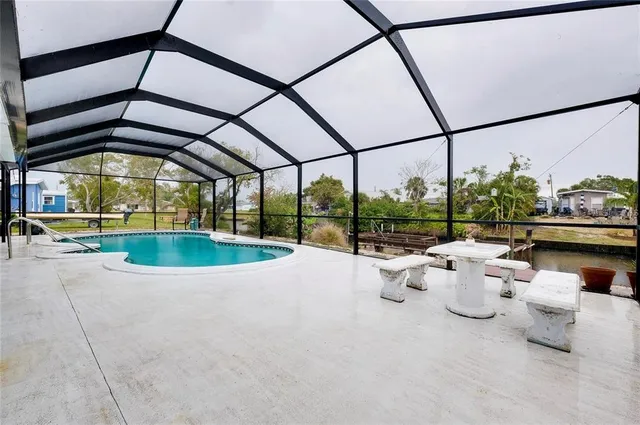 a view of a swimming pool with a patio