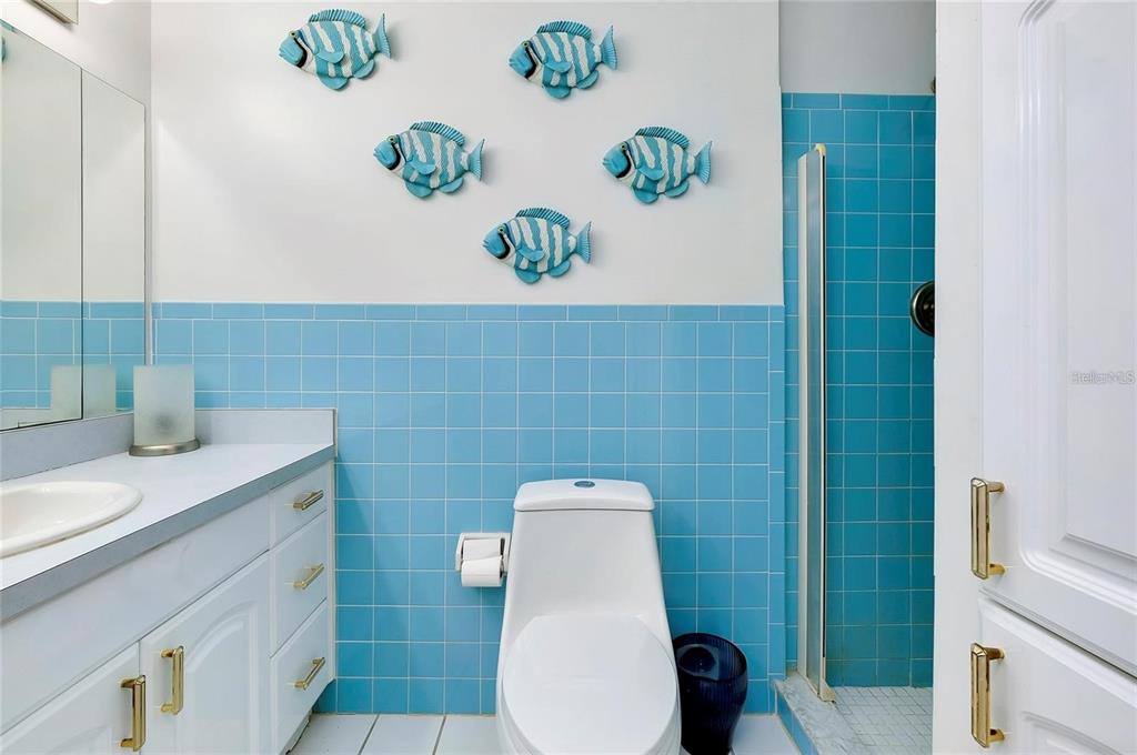 6560 Marius Road North Port, FL 34287 - Photo 6 of 35 a bathroom with a sink a toilet and a shower