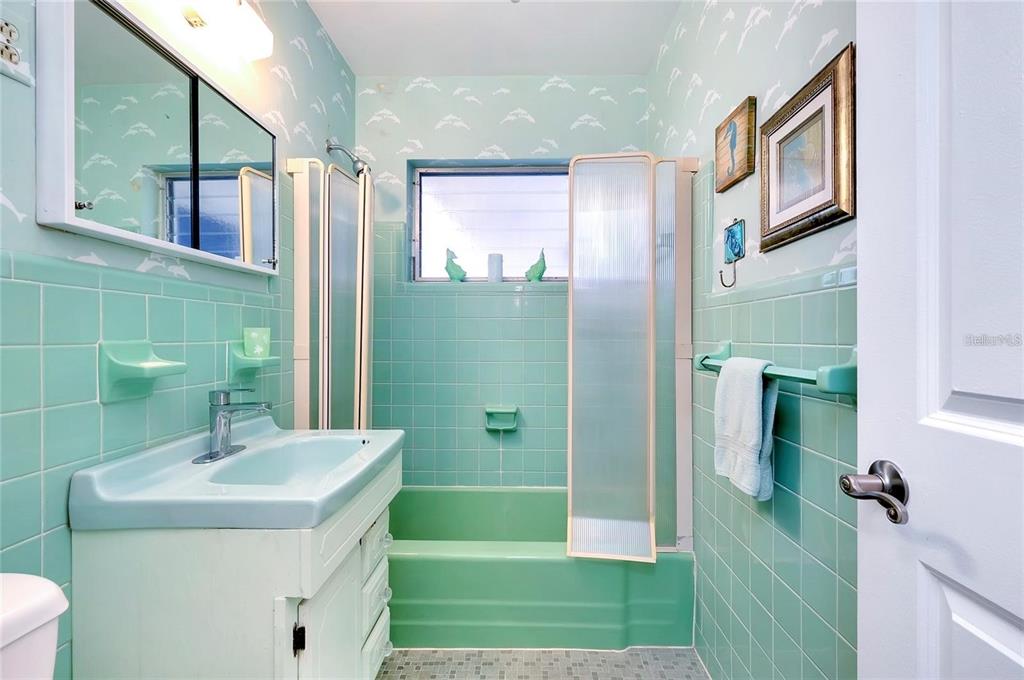 6560 Marius Road North Port, FL 34287 - Photo 9 of 35 a bathroom with a sink a toilet and a mirror