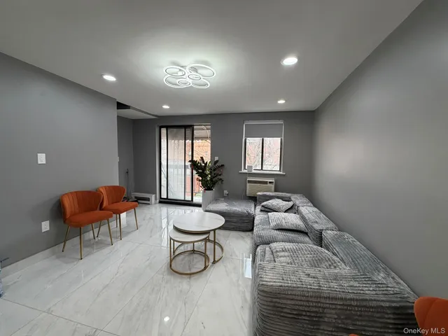 a lobby with furniture and a potted plant