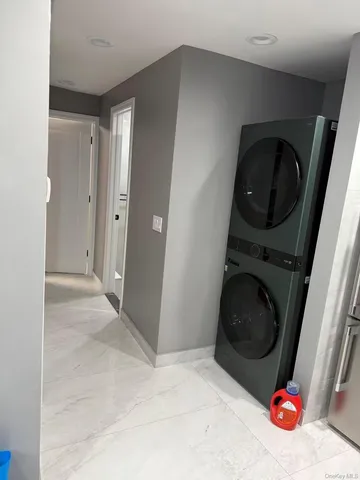 a view of a hallway with washer and dryer
