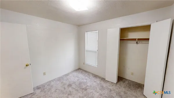 an empty room with closet