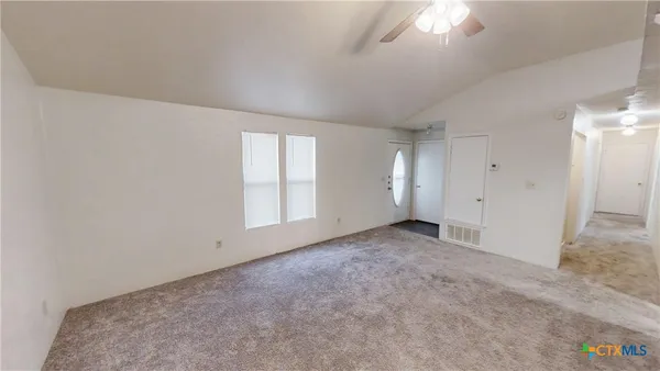 an empty room with windows
