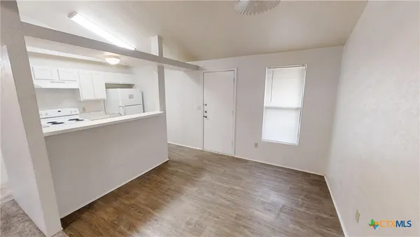 a view of kitchen with wooden floor
