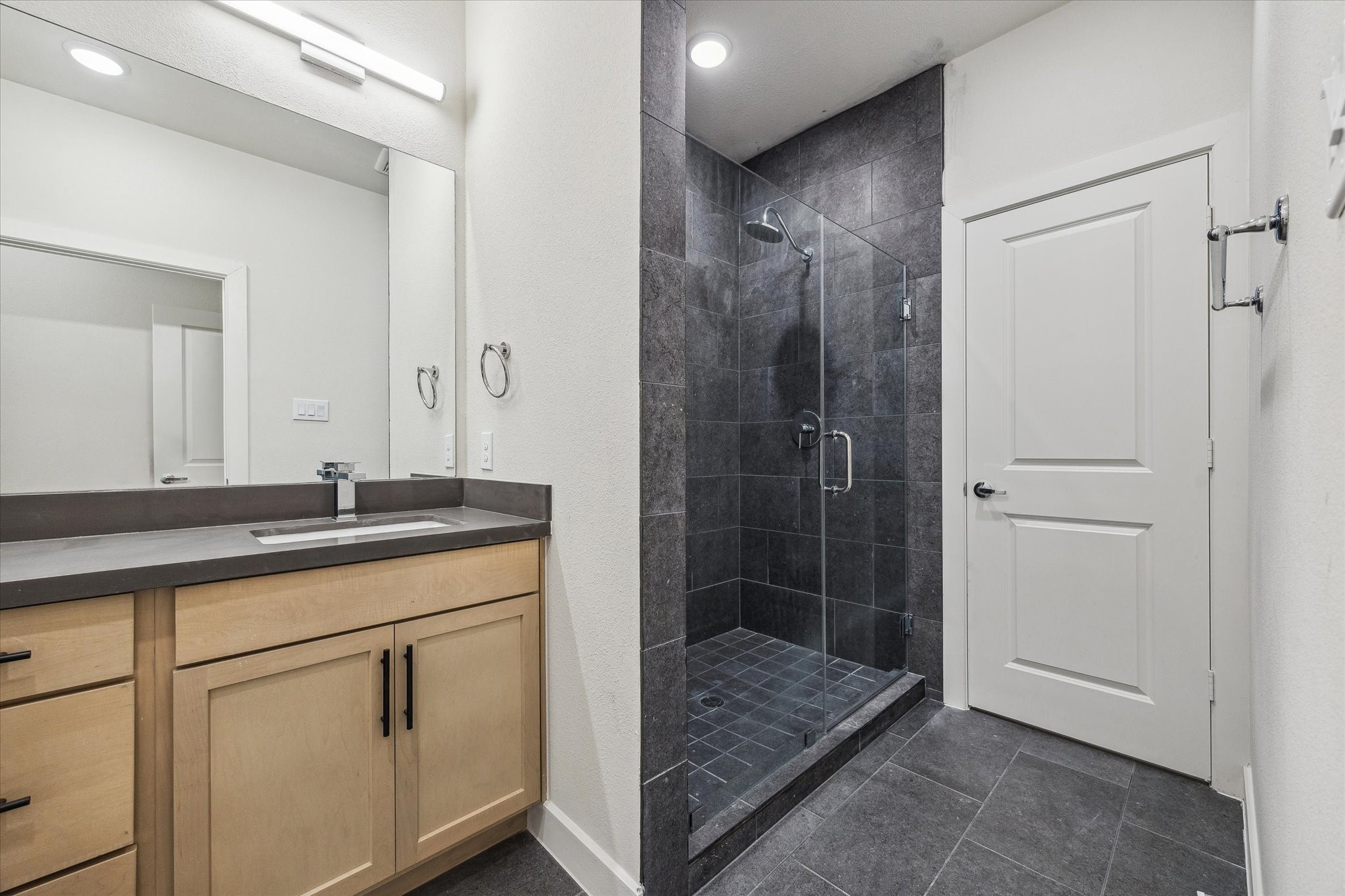 6547 Rena Street Houston, TX 77092 - Photo 8 of 10 Primary Bathroom – Previous work by the builder in the community, not representation of exact unit listed.