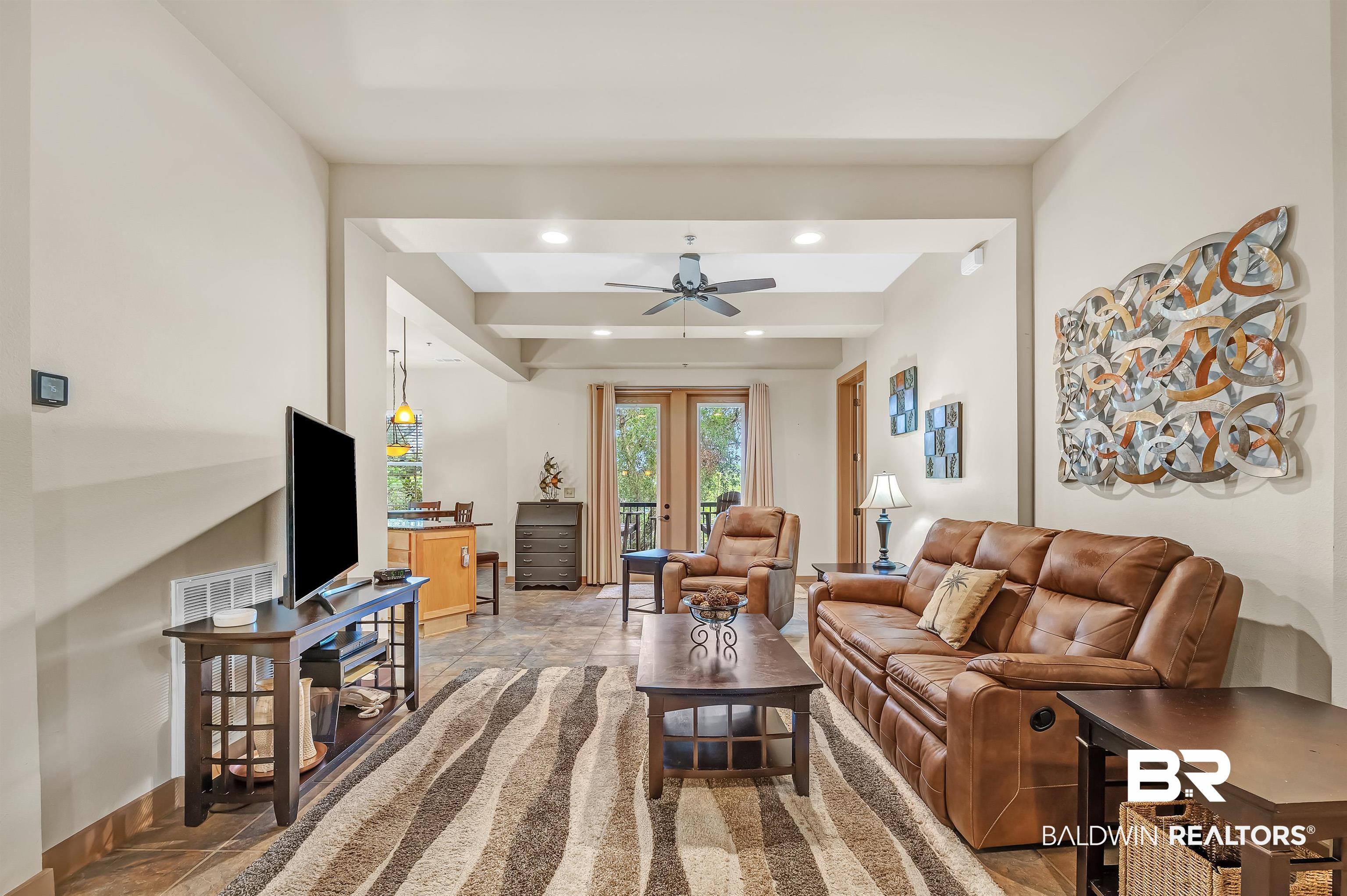 1430 Regency Road, Unit C201 Gulf Shores, AL 36542 - Photo 24 of 54 Living room featuring a ceiling fan and recessed lighting