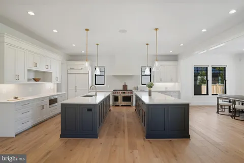 a bathroom with a double vanity sink mirror and double