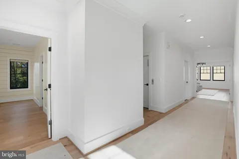 a bathroom with a sink and mirror with toilet