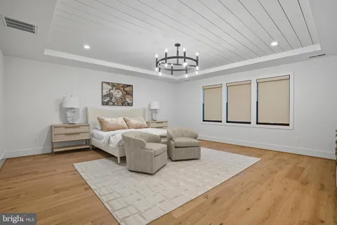 an aerial view of a house with a big yard and large trees