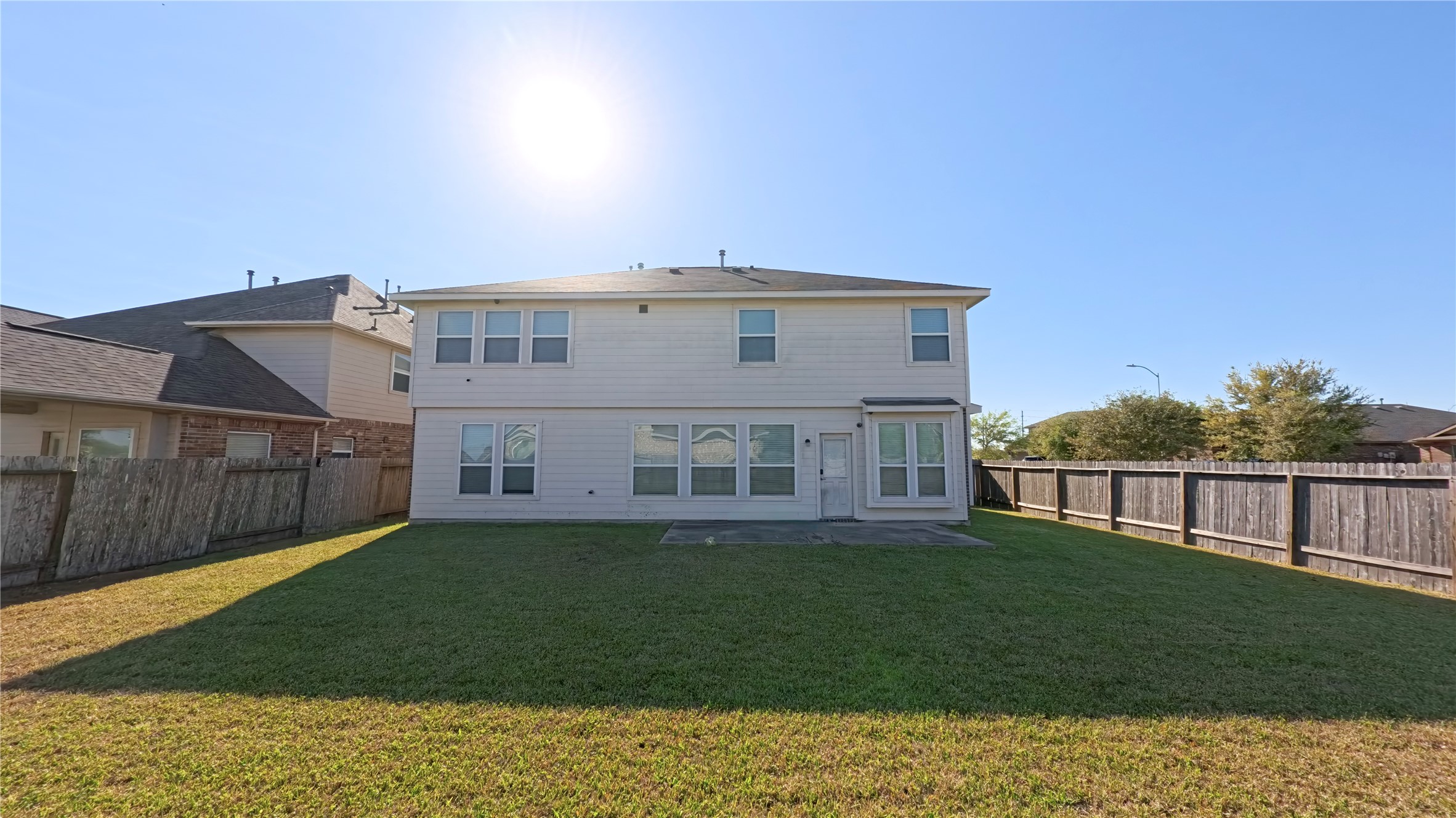 9707 Shimmering Lakes Drive Rosharon, TX 77583 - Photo 18 of 19 a view of a big house with a big yard and large trees