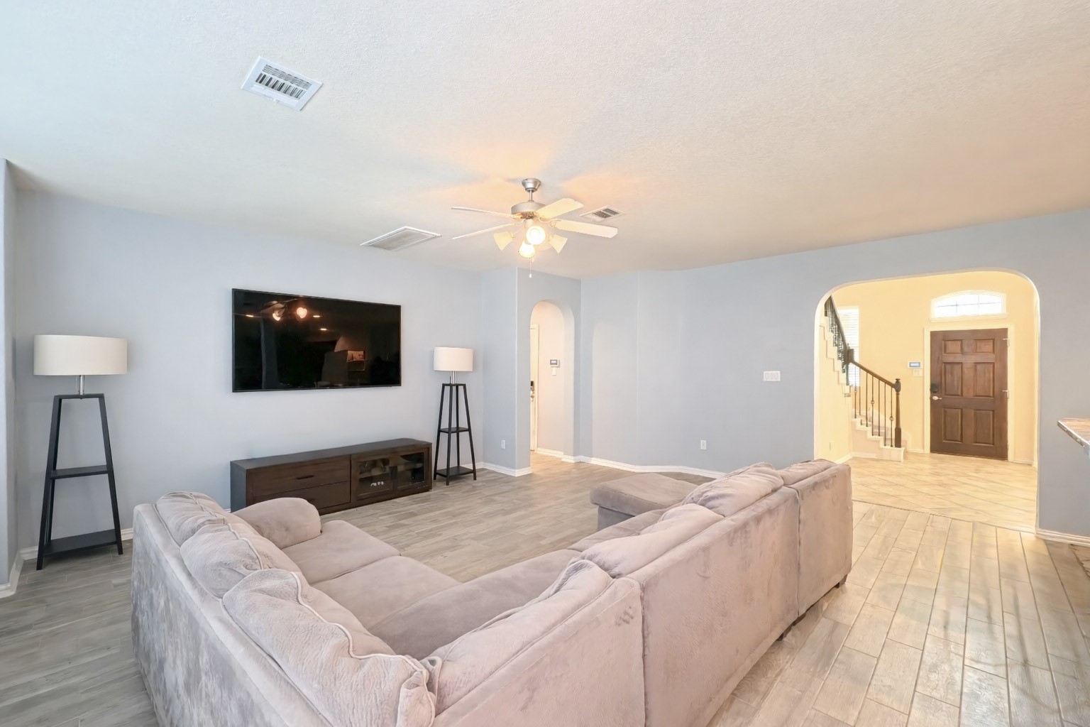 9707 Shimmering Lakes Drive Rosharon, TX 77583 - Photo 4 of 19 a bedroom with a large bed and a chandelier
