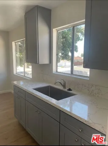 a kitchen with a sink and a window