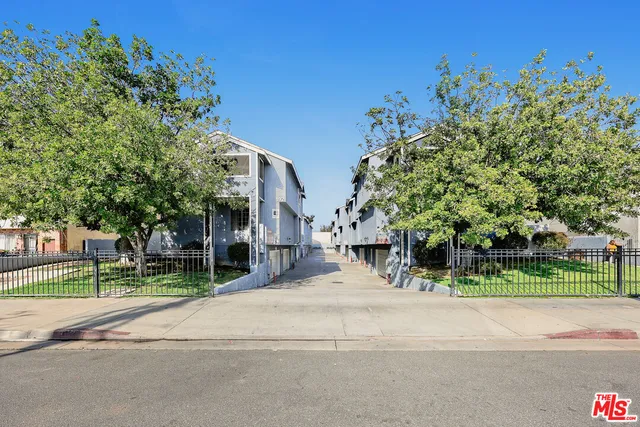 a view of road with a house in the background