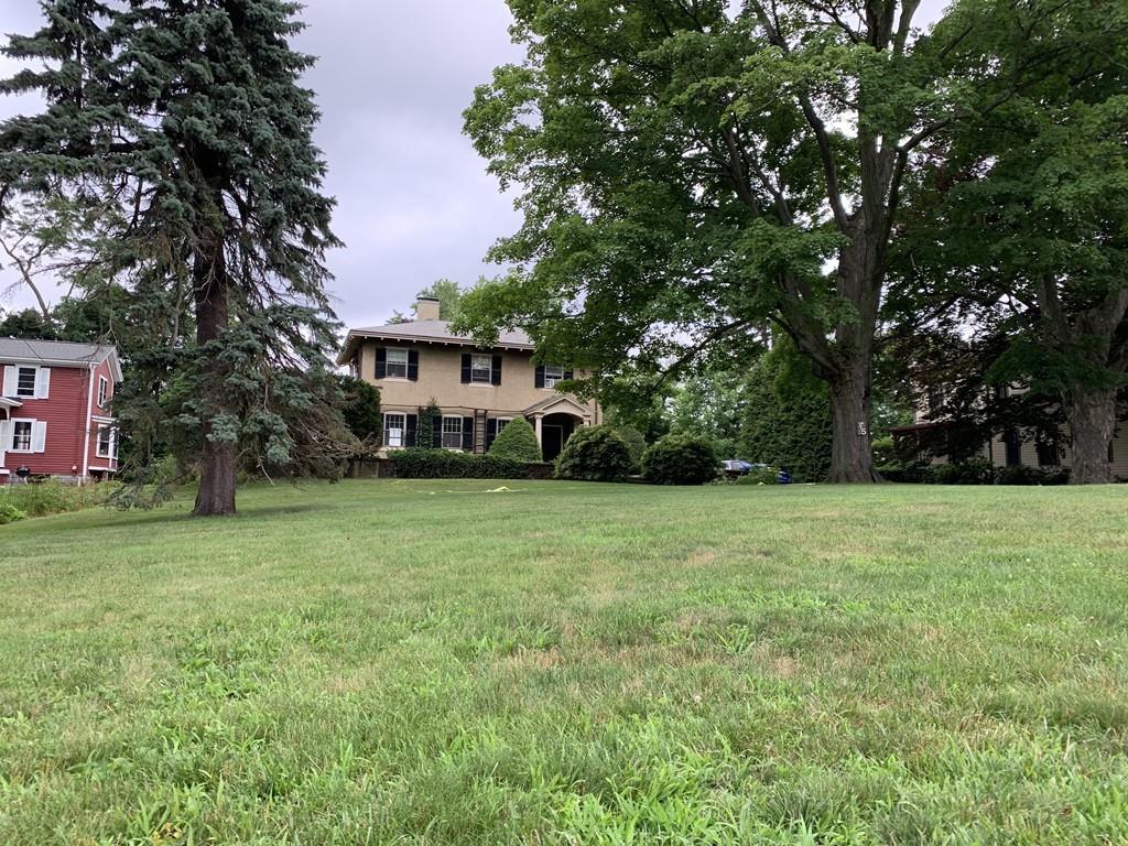 75 Pleasant Street Newton, MA 02459 - Photo 1 of 14 a view of a house with a yard