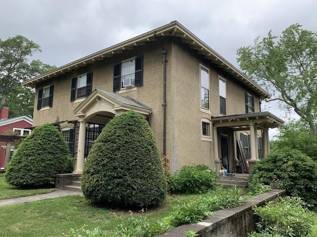 75 Pleasant Street Newton, MA 02459 - Photo 12 of 14 a front view of a house with garden